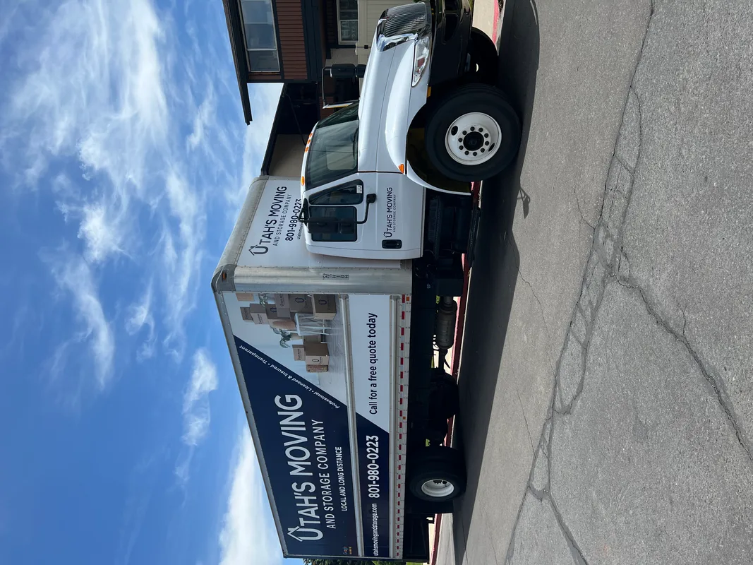 Utah's Moving & Storage branded moving truck on a Utah street on a sunny day
